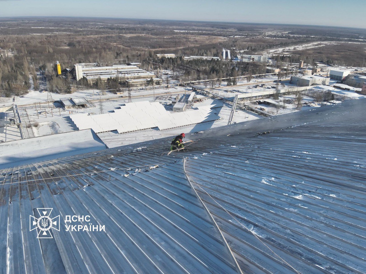 Emergency crews continue work on the damaged New Safe Confinement after a Russian drone strike, partially opening sections of the structure to extinguish smouldering areas. Photo credit: SES Ukraine